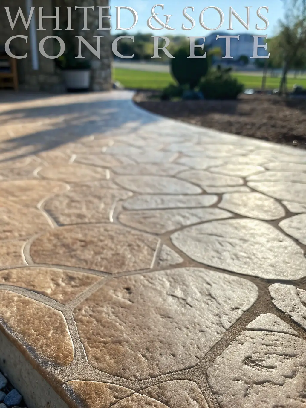 A close-up shot of decorative concrete work, showcasing intricate patterns and high-quality finishing by SANDSTONE CONCRETE.